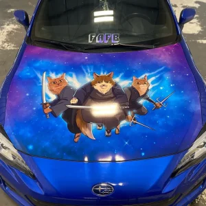 The hood of a blue car wrapped with cartoon graphics