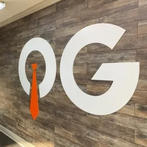 thin cut logo on wood wall in an indoor office