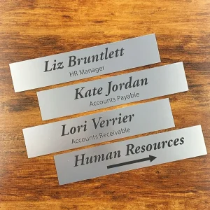 Four engraved lamacoid name signs for office